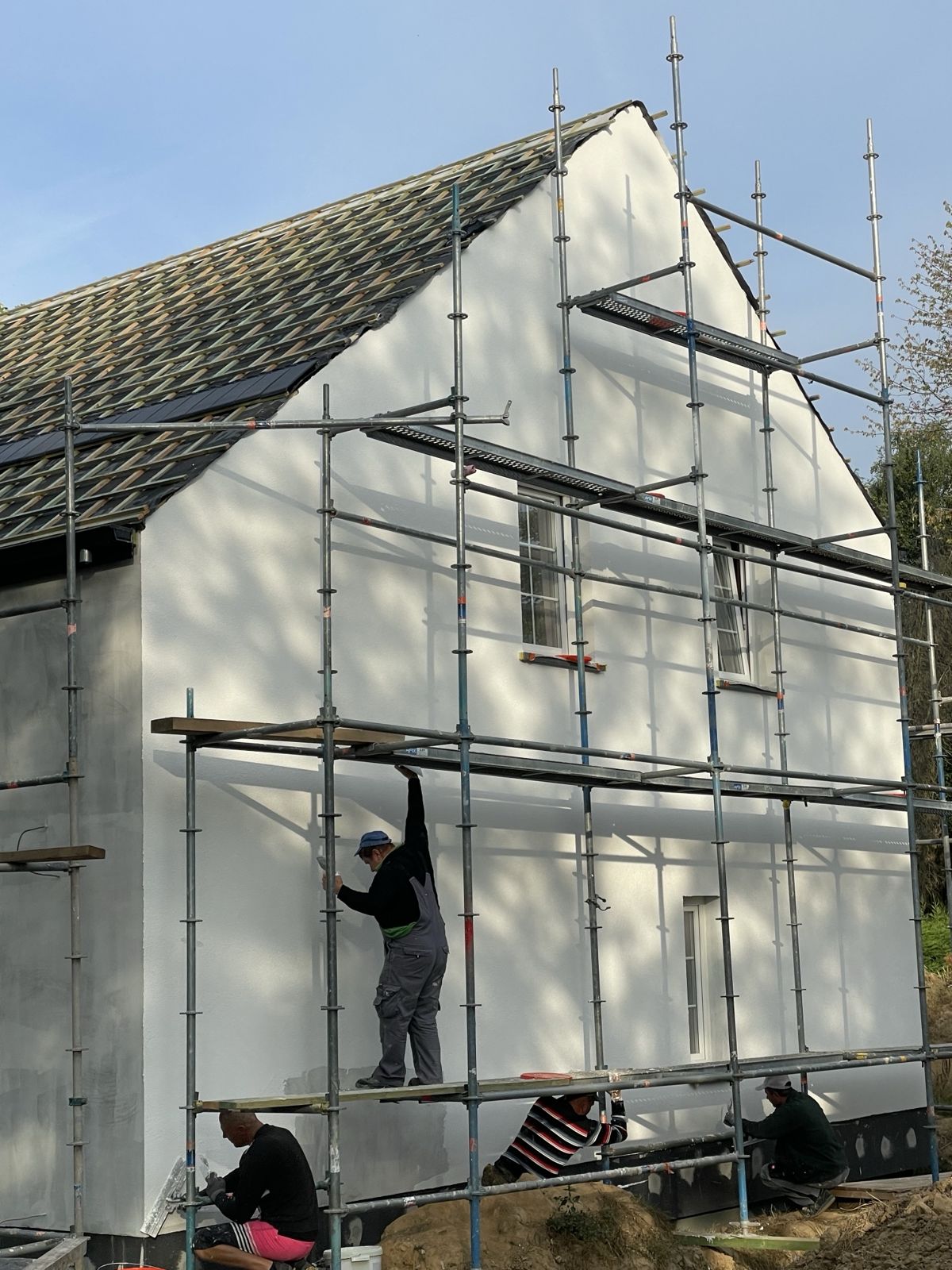 Pose de l'enduit sur l'isolation de façade par l'extérieur, pignon
